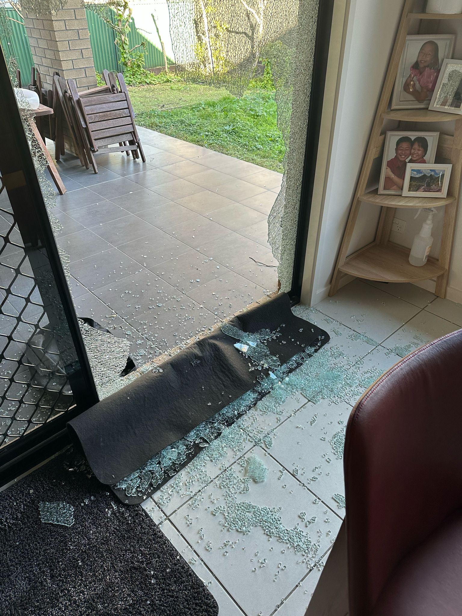 Shattered sliding door glass secured on site