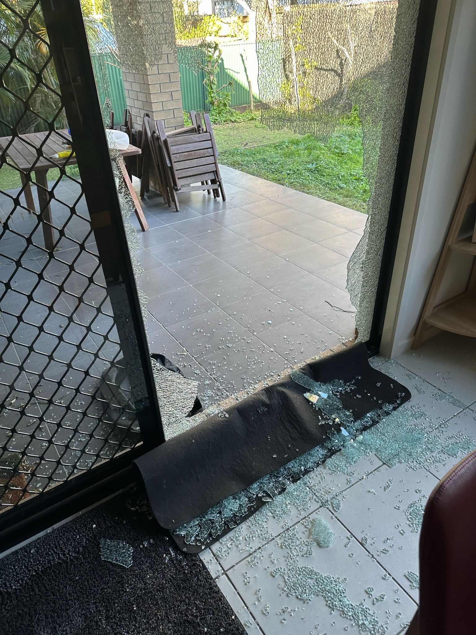 Shattered sliding door glass — the kind of photo that speeds up your quote